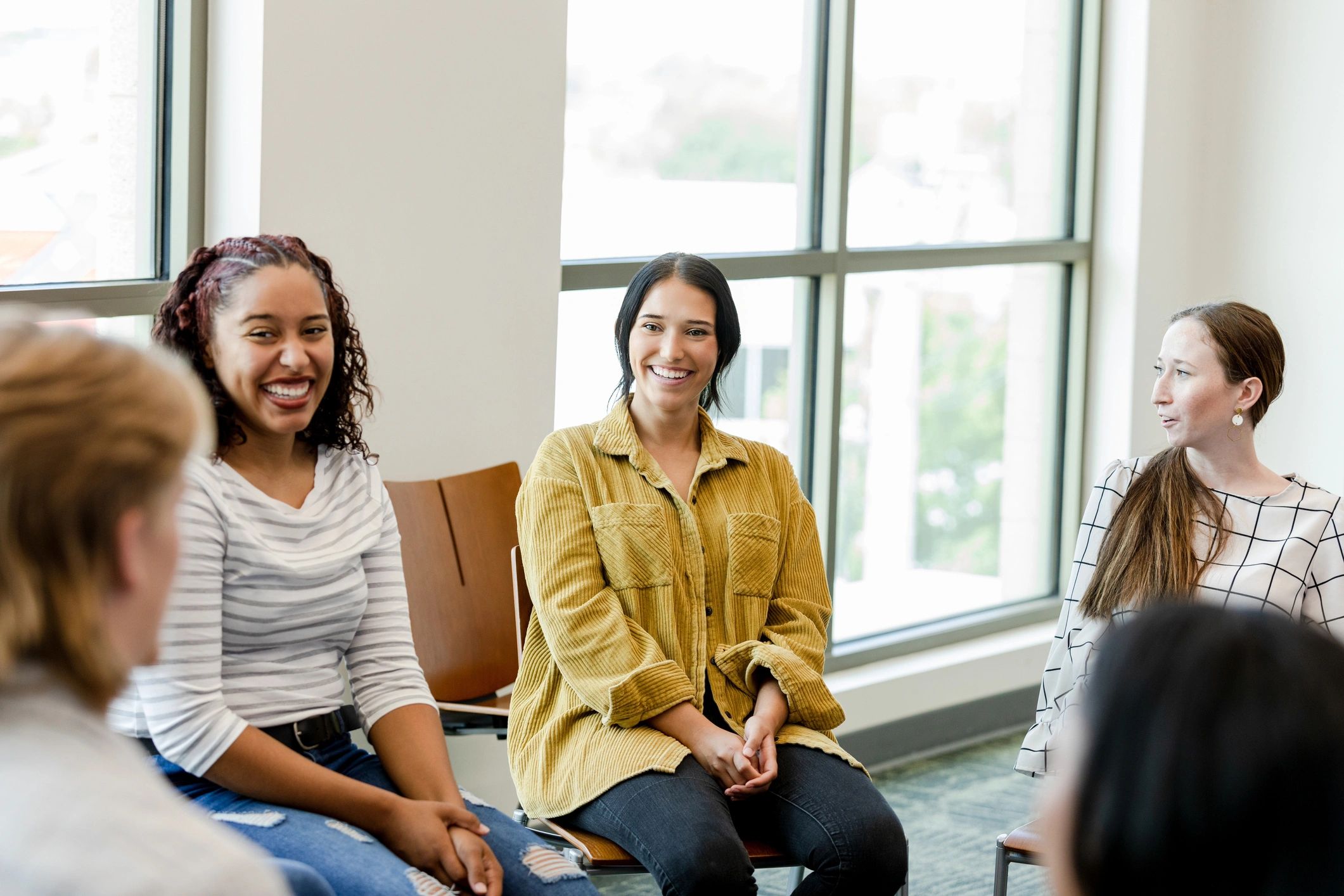Women gathered in a supportive group conversation