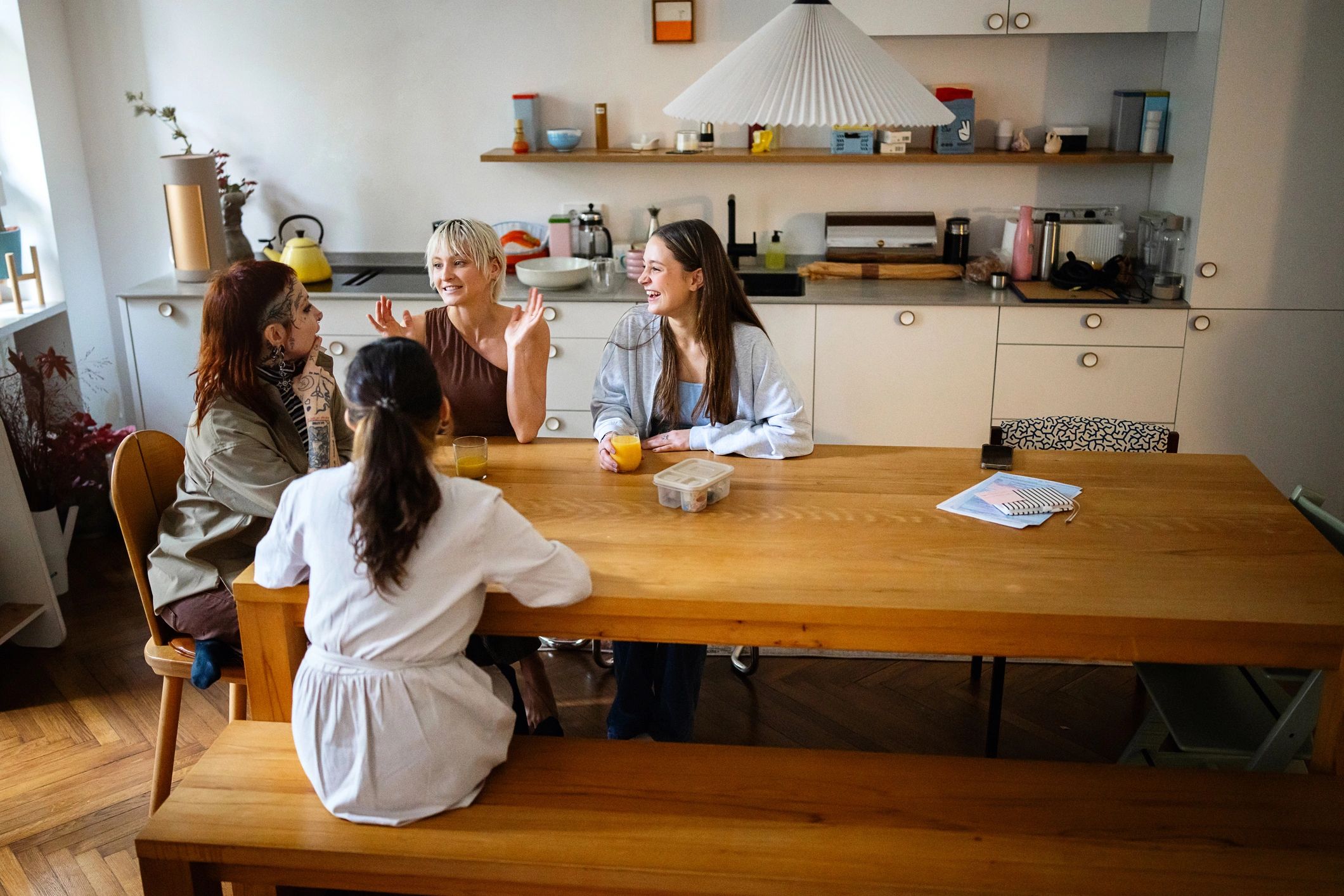 Friends celebrating together at home, supportive community